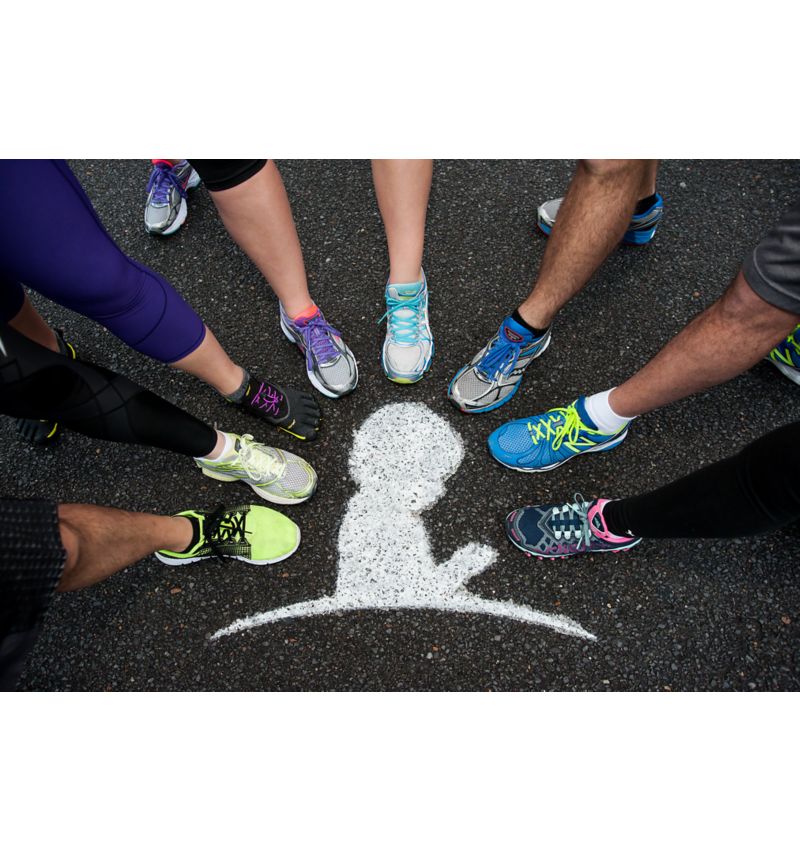 photo of feet clad in running shoes making a circle around a St. Jude child logo