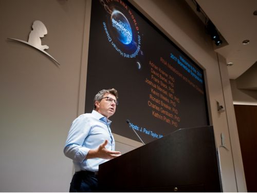 J. Paull Taylor speaking at a podium