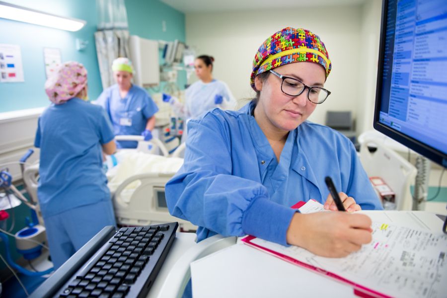 Doctor checking eyes of male child