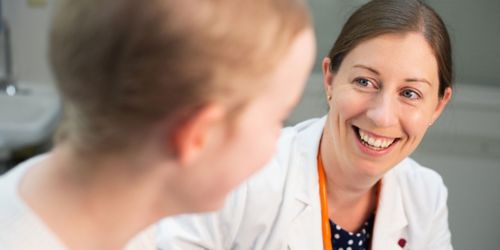 Image of Aimee Talleur talking to patient