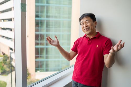 Photo of Young-Goo Han standing next to a window