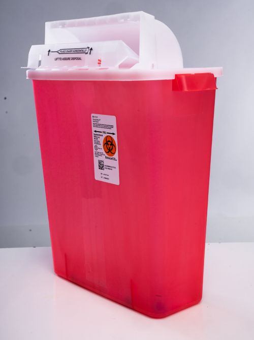 Sharps containers have hard sides and a twist on top to keep sharp objects safely inside. 