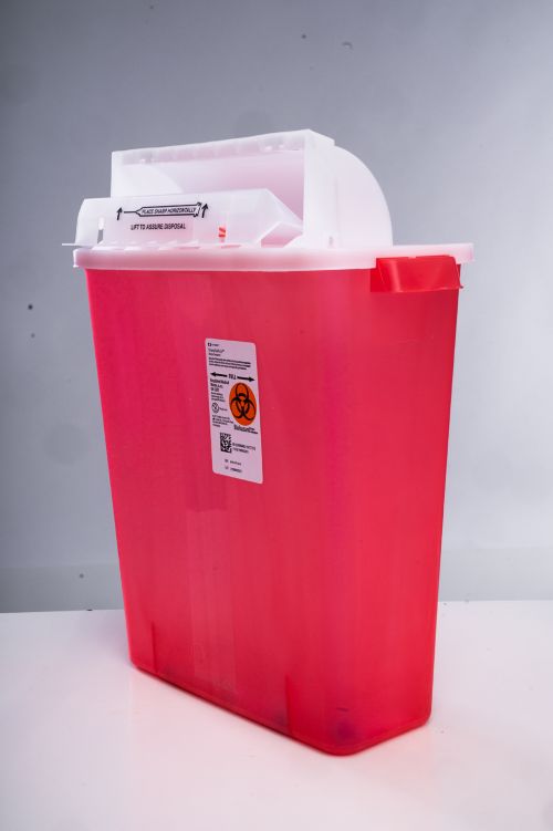 Sharps containers have hard sides and a twist on top to keep sharp objects safely inside. 