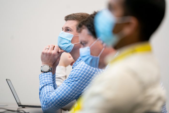 Participants wearing masks during biohackathon