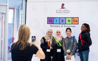 Photo of Science Scholars taking turns posing for photos