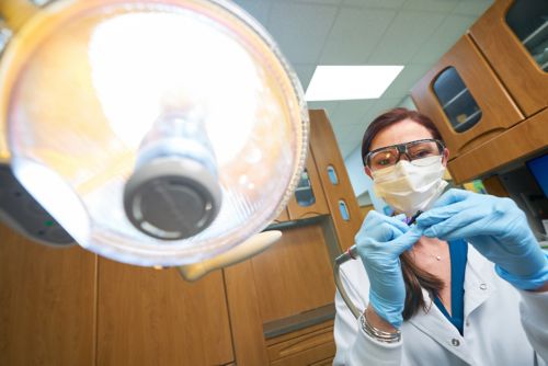 oral surgeon at work