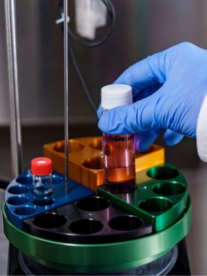 photo of someone placing test tubes in a machine