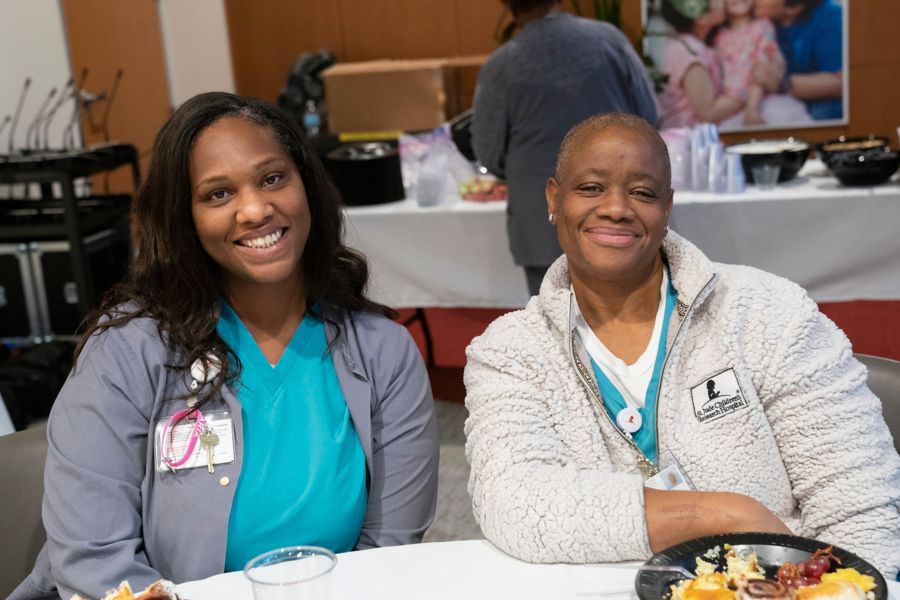 Two female nurses at Friends of Nursing breakfast event
