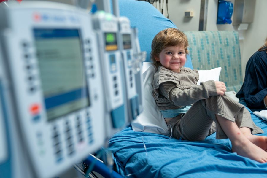Child in hospital room receiving chemo