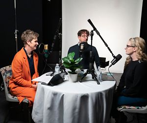 Paula Elsener, Jason Winkle, and Erica Sirrine sitting at table recording