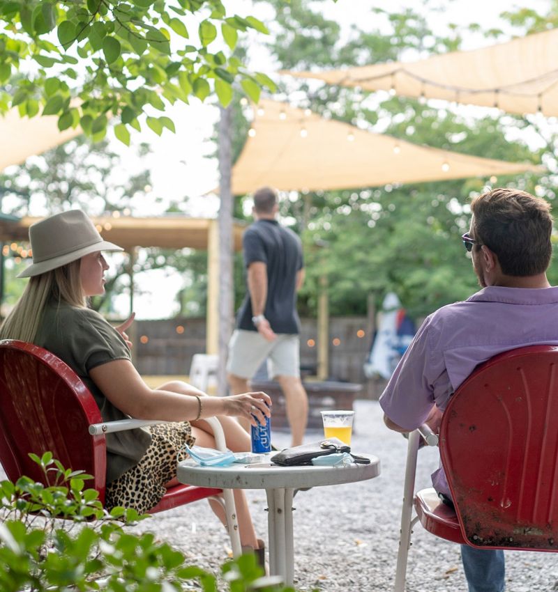 Couple sitting outdoors at Loflin Yard in Memphis, Tennessee