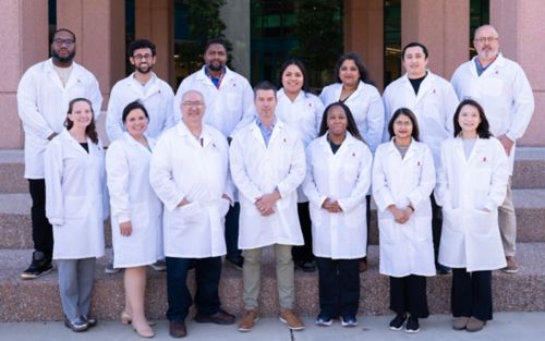 group shot of scientists in white coats