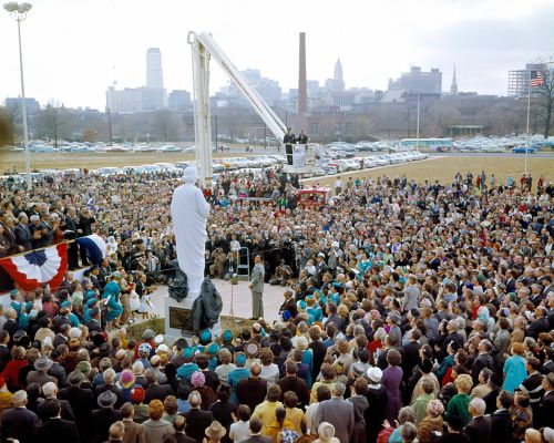 image of crowd of people surrounding a statue of St. Jude that has just been unveiled.