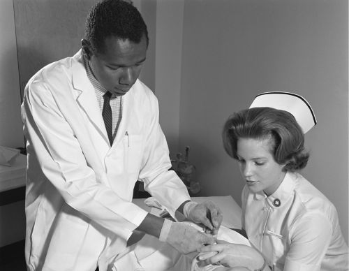 black and white photo of doctor and nurse 