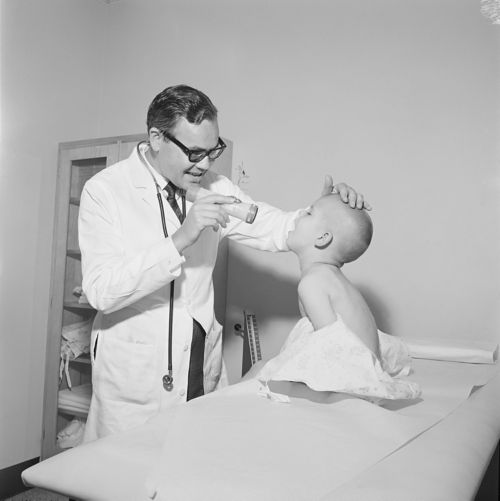 black and white photo of doctor with patient