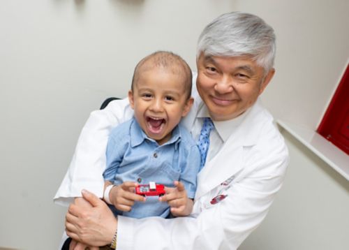 Dr. Pui with a patient
