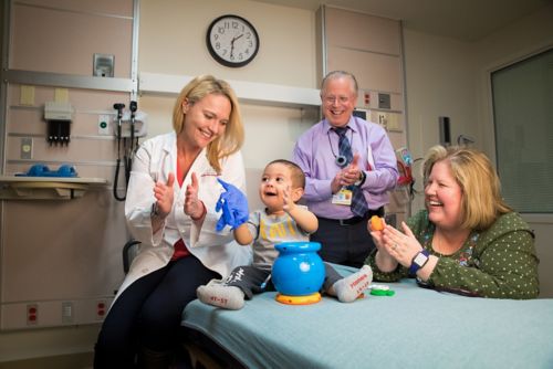 doctors and nurse with young patient