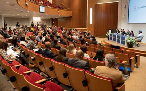 People gathered in auditorium for 2022 Global Allilance Convening