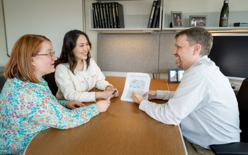 Photo of Steven Varga with two colleagues