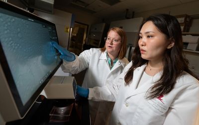 photo of woman at lab desk