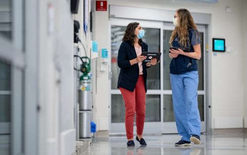 Photo of two women in hallway