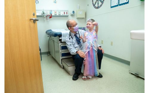 Doctor talking to patient in exam room