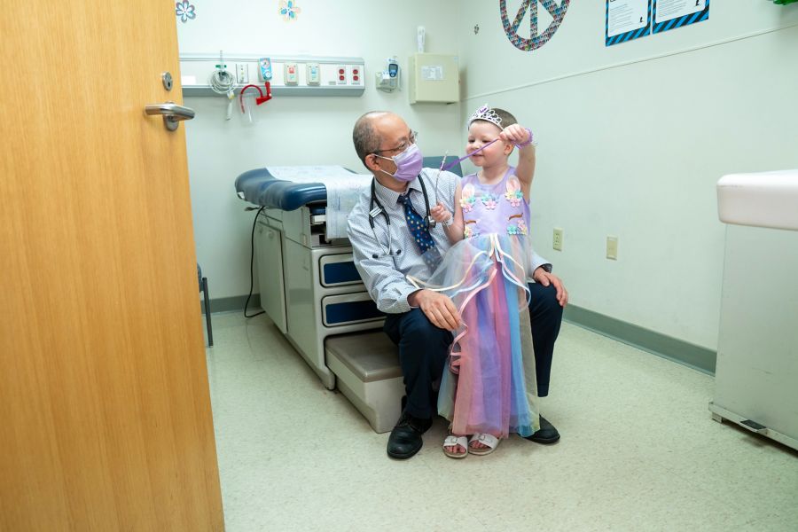 Doctor talking to patient in exam room