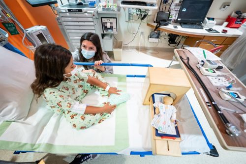 Child patient waiting to receive MRI scan in hospital bed