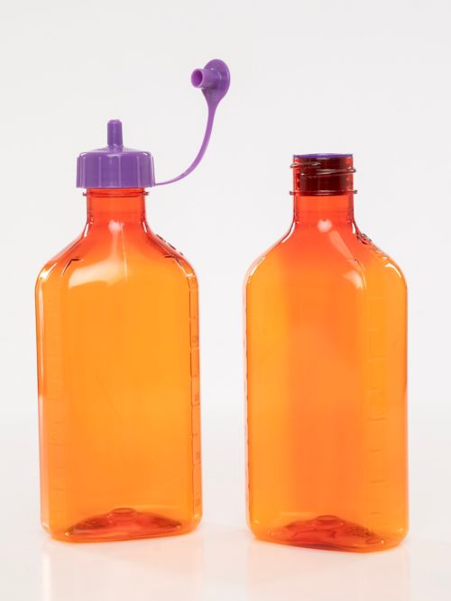 A bottle adaptor or fill cap goes on the medication bottle to fill the syringe.