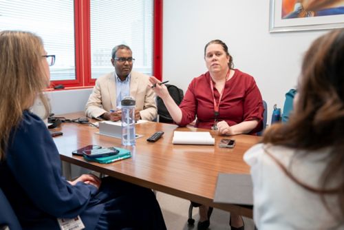 Katrina Pennington, RN, discusses clinical logistics in an EAGER Clinic meeting. 