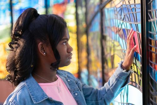 Teen girl at chapel in St. Jude Children's Research Hospital