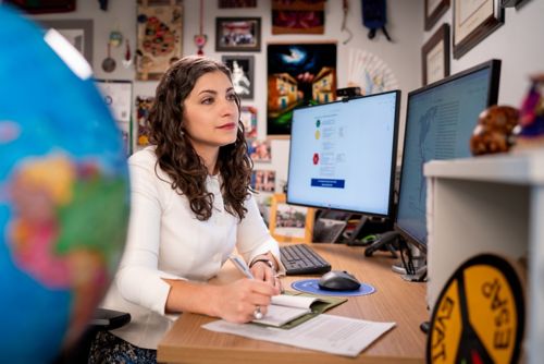 Dr. Asya Agulnik at her desk