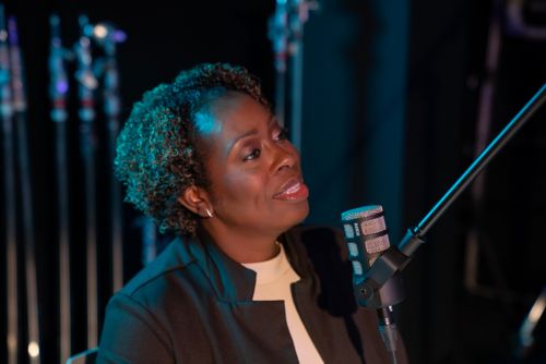 Woman speaking into microphone