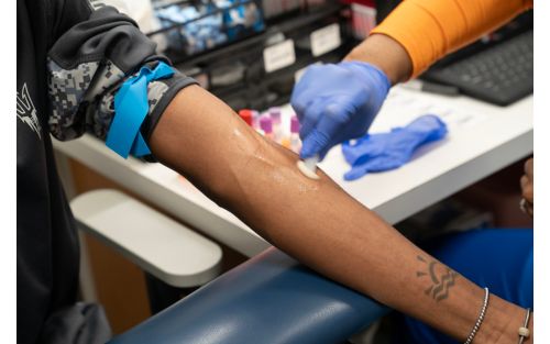 Readying a patient's arm for a blood draw