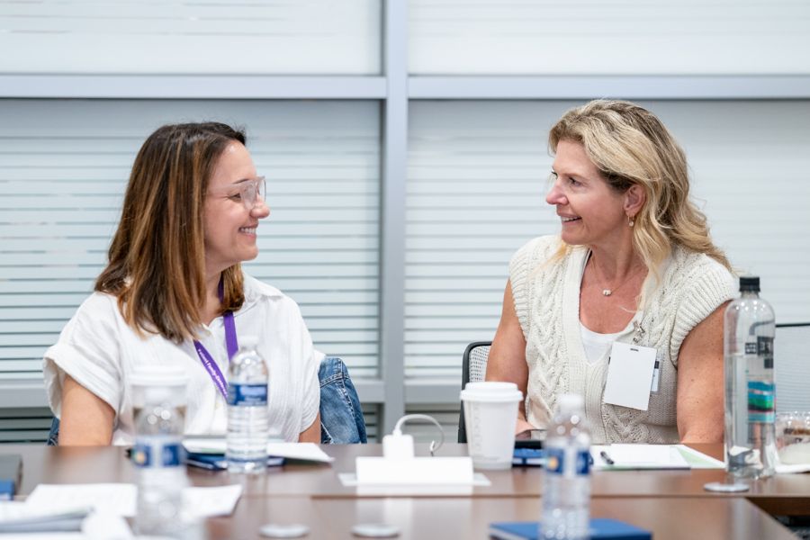 Two staff members talking 