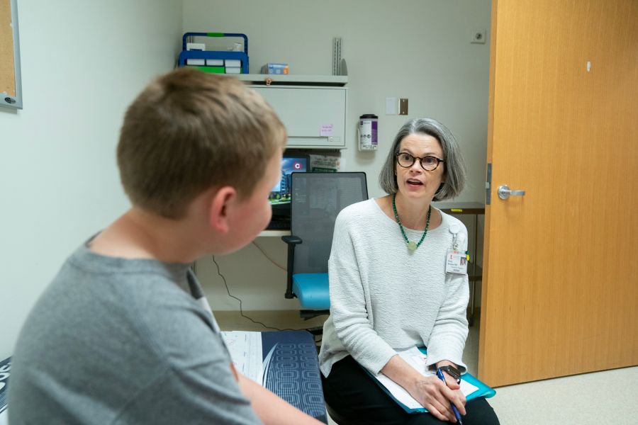 Female doctor talking with male patient