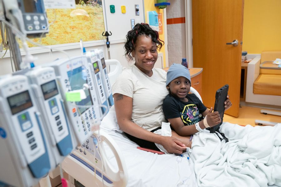 African-American mother and child in a hospital bed