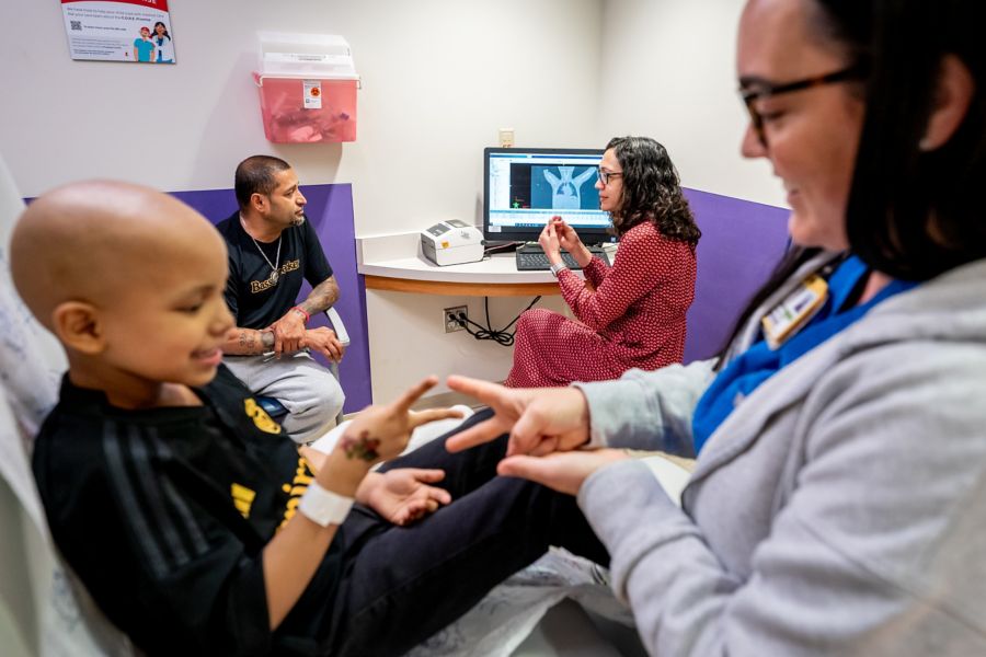 young patient with a doctor in an exam room