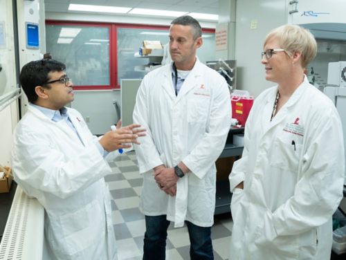 Kiel Neumann, PhD, and Amy Vavere, PhD, (right) Asim Bag, MBBS, MD (left).