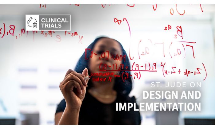woman writing on glass board