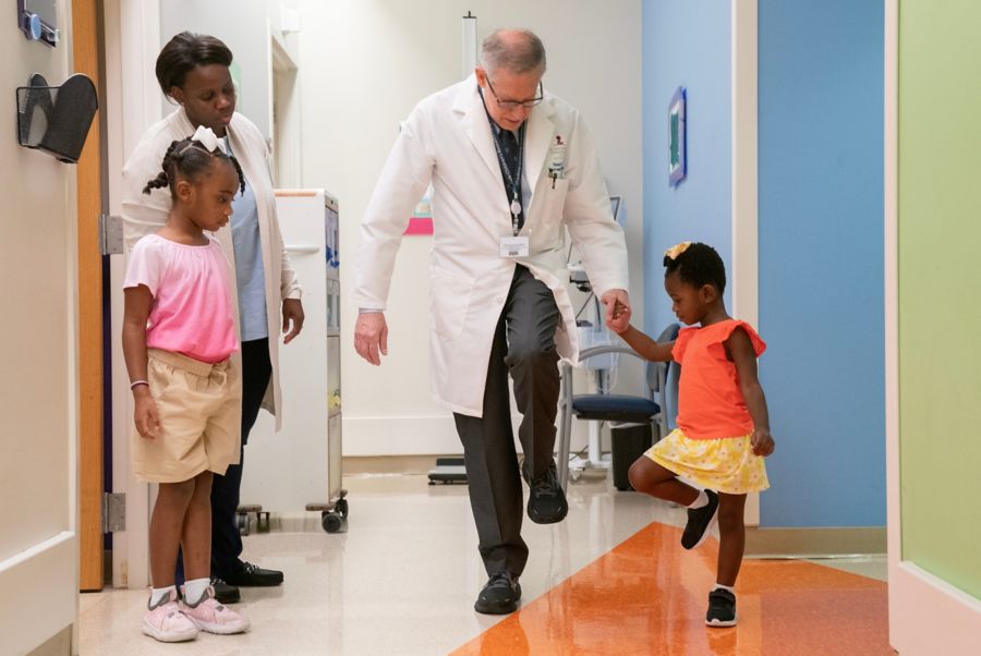 Dr. Richard Finkel with a patient family: a mother and two daughters