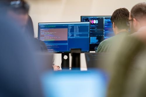 Computer screens in a row