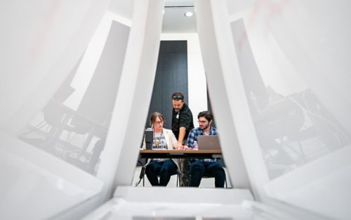 People working at a table 