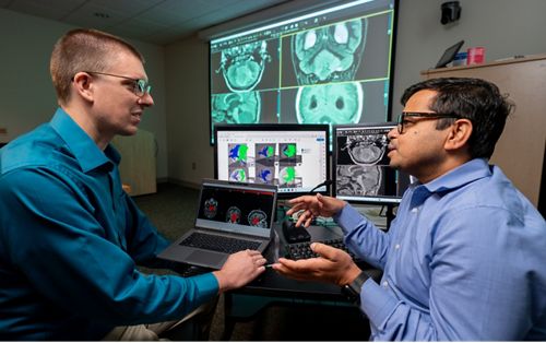image of three people at a table