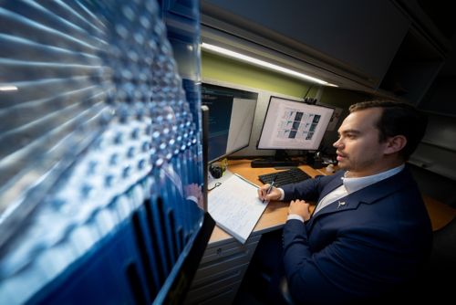 Zachary Wooten looking at computer