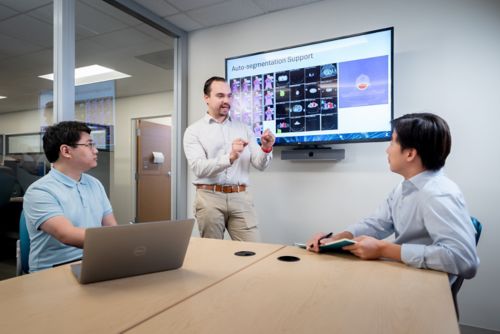 group of men in a huddle room