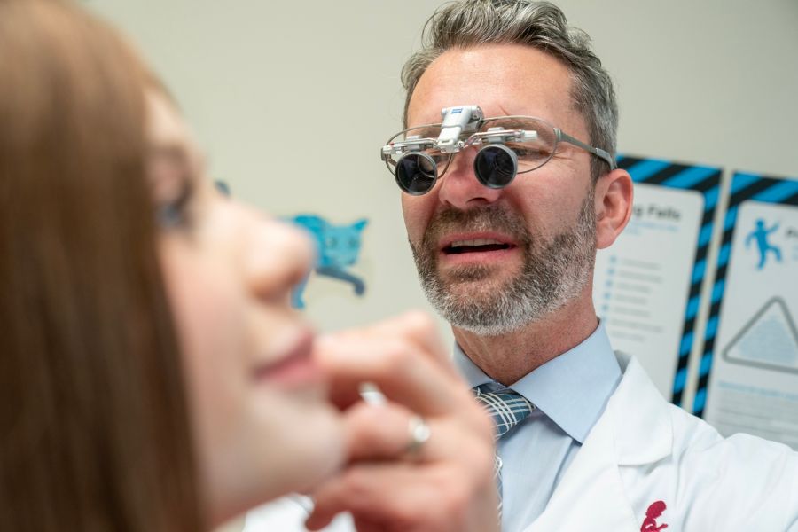 Male doctor examining female patient