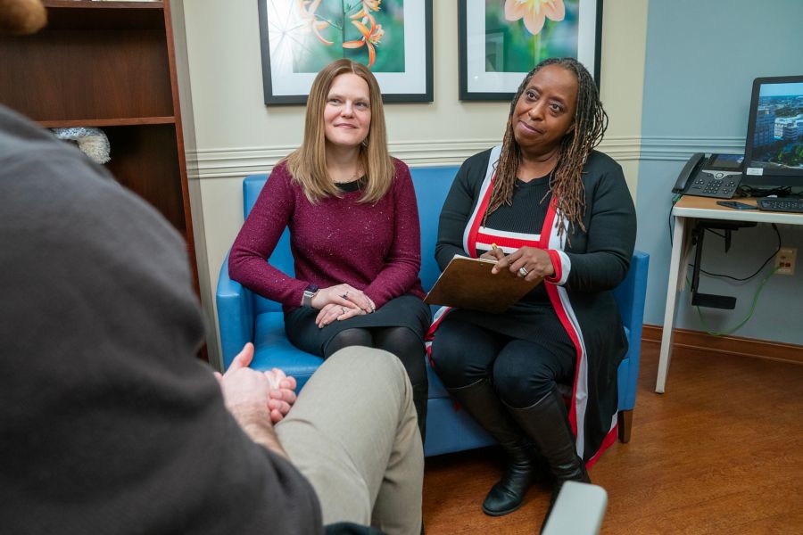 A female counselor leading a group discussion