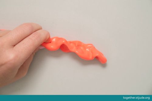 Pinching putty with fingers