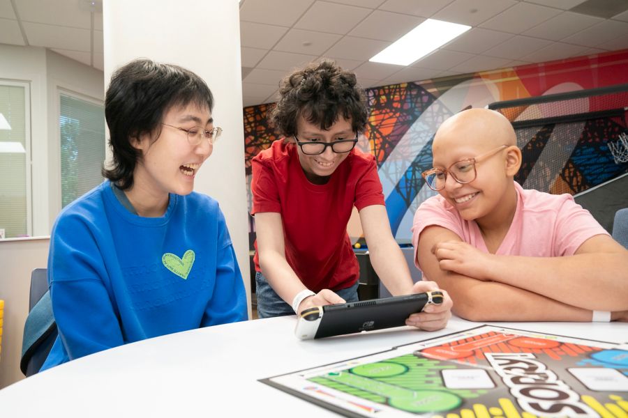 Image of three teens at the Teen and Emerging Adults program